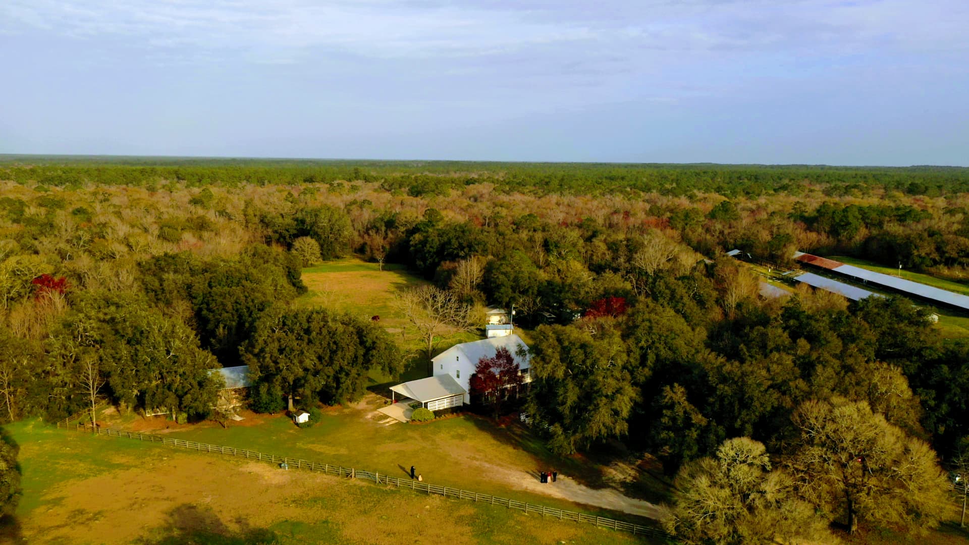 Aerial view of manor house and pastures