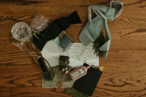 Wedding invitation with bands, perfume and wedding shoes